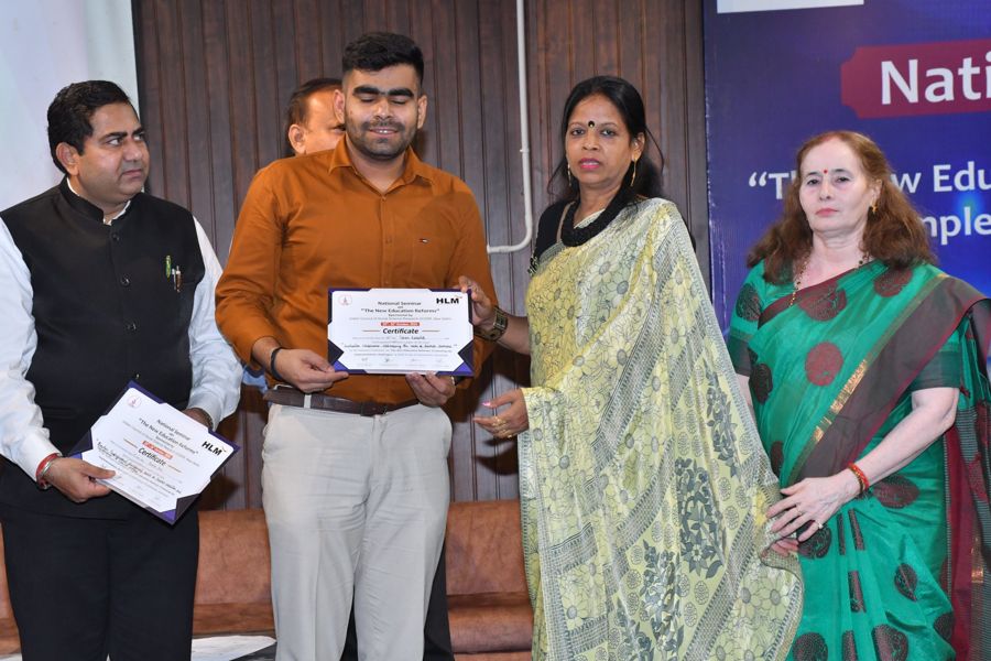 Participant receiving a certificate from the dignitaries