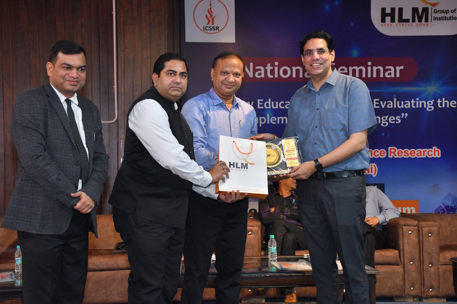 Felicitation of the guest speaker with a memento at the National Seminar