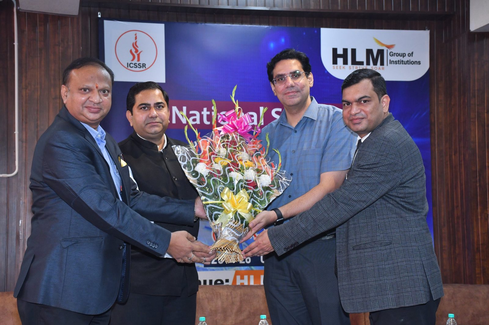 Welcome of the guest with a bouquet at the National Seminar